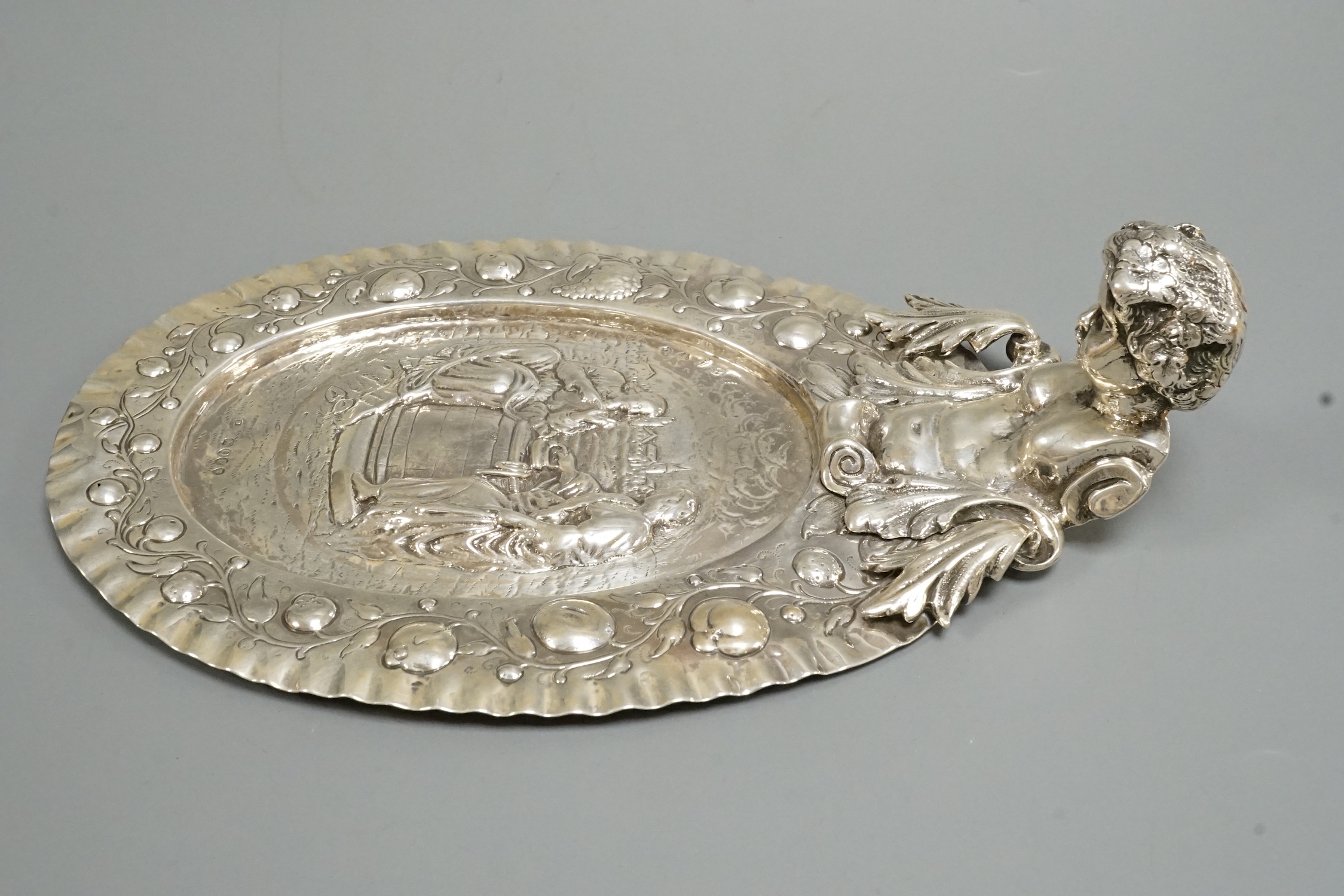 A late 19th century Hanau silver oval dish, with figural handle, import marks for David Bridge, London, 1891, 27cm, 12.4oz.